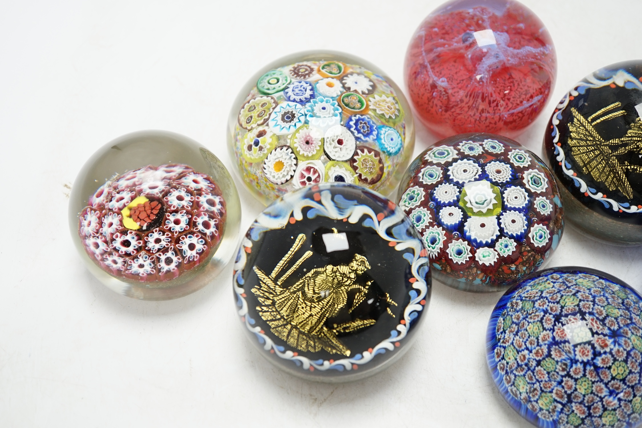 A group of eight various glass paperweights including millefiori, tallest 8cm. Condition - varies, poor to fair